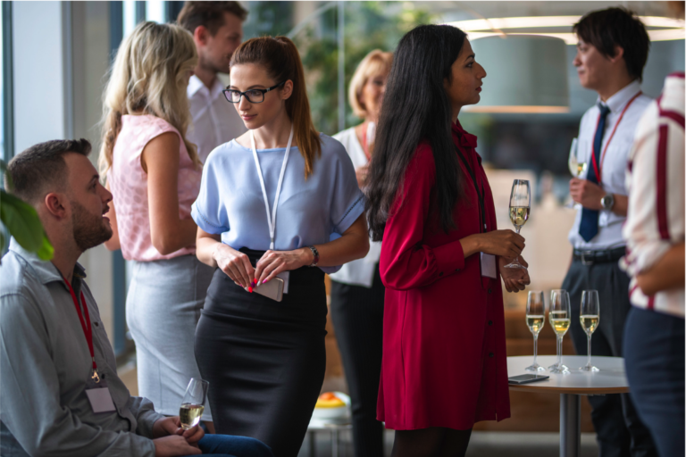 International professional using character strengths to network across cultures at a professional event